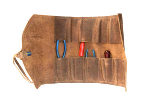 Our Large Tool Roll works well for standard size tools such as mechanics and woodworking wrenches and screwdrivers. Our heavy duty leather tool rolls are designed to organize and protect your tools. They lay flat for use and roll up for storage. They are stitched with strong nylon thread and close with solid brass rings and leather thongs.