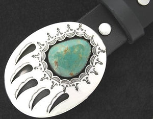 Silver metal Bear Claw belt buckle with turquoise stone. Oval shape with 5 claws and sun burst pattern around the stone.    Belt loop width measurement: 1.5"