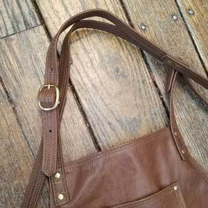 Soft pocketed leather apron with cross back straps and ties at the waist. Long version 38" long x 24.5" wide