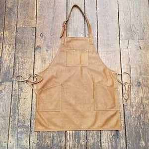 Soft leather apron, 3 pockets with over the neck straps and ties at the waist. Regular length 28" long x 24.5" wide