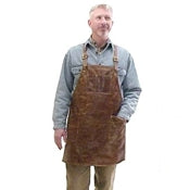 Soft pocketed leather apron with cross back straps and ties at the waist. Regular 28" long x 24.5" wide